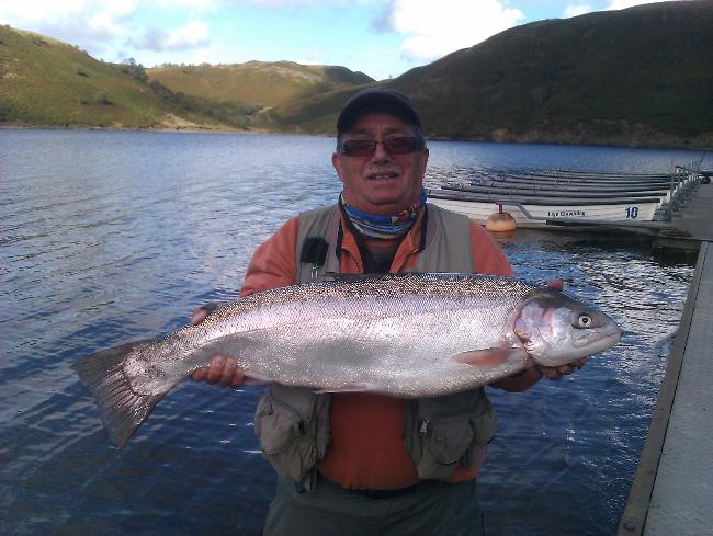 John Finch with the seasons best 15lb 5oz rianbow taken on a black daddy